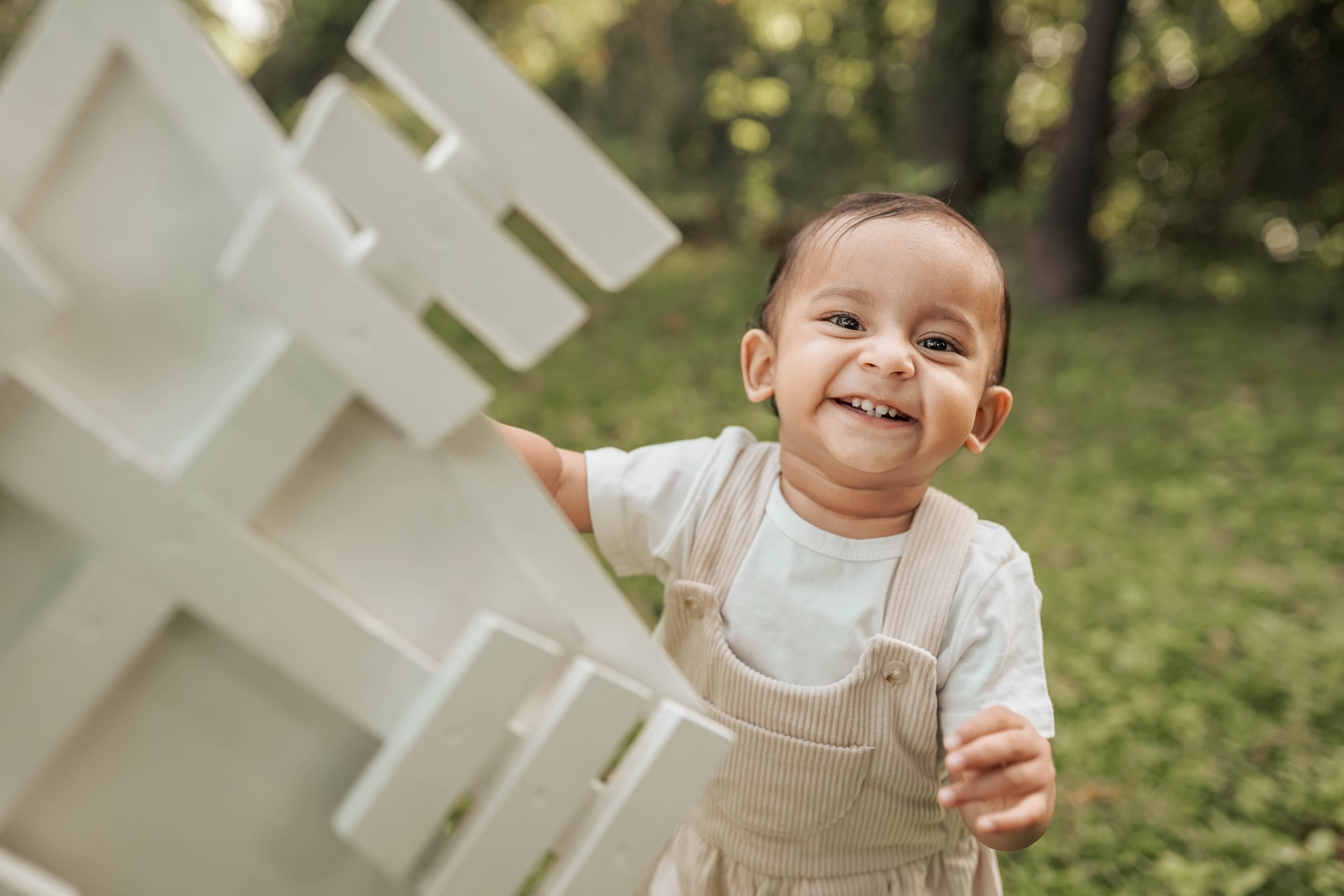 south asian indian baby boy windmill outside